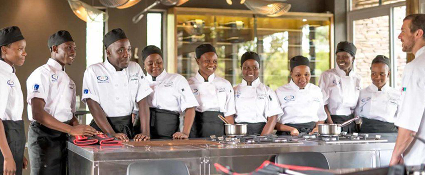 A chef and his team in a kitchen in South Africa