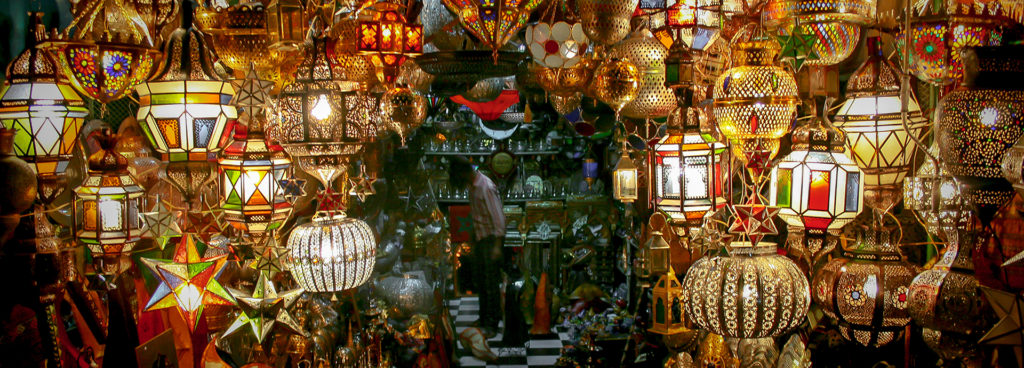 Beautiful glazed lamps hanging in a souk in Marrakech