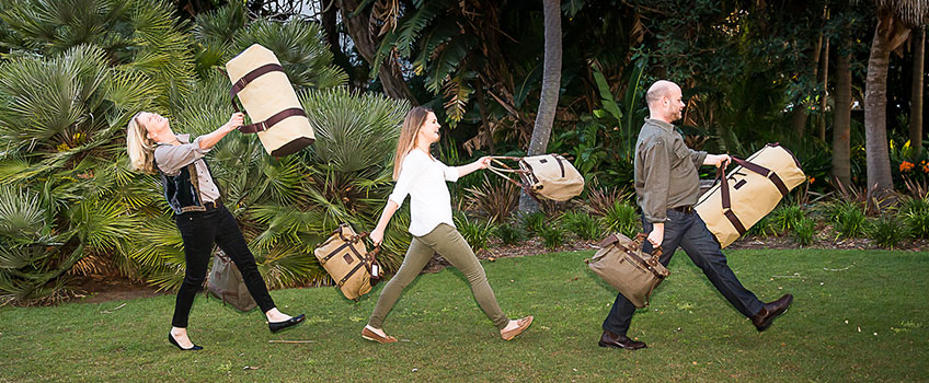 A group of cheerful people with luggage