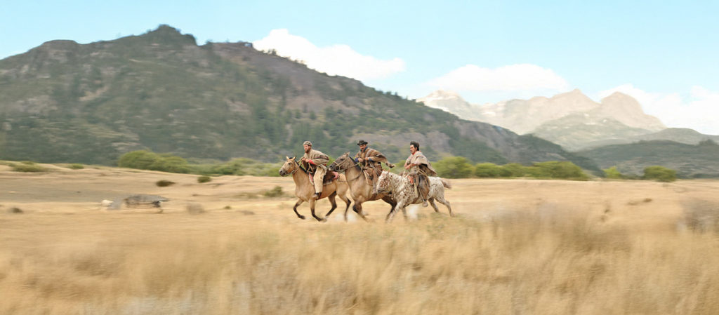 Gauchos Riding Across The Plains of Patagonia, Argentina