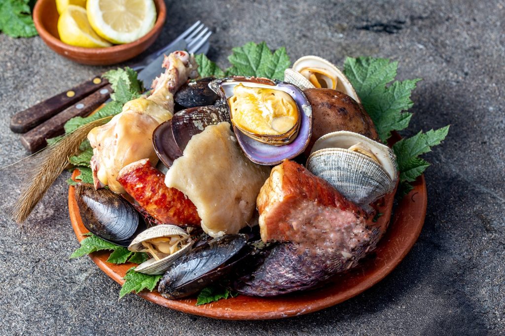 Curanto traditional Chilean meat and seafood dish