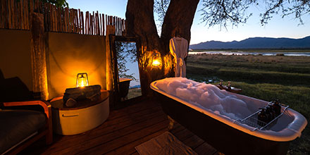Luxurious bath at sunset at Ruckomechi Camp, Mana Pools National Park, Zimbabwe