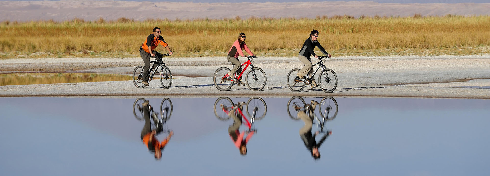 Guests at Chile Explora explore the Atacama Desert by bicycle