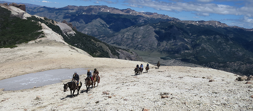 Horseriding along a valley in Argentina with Jakotango