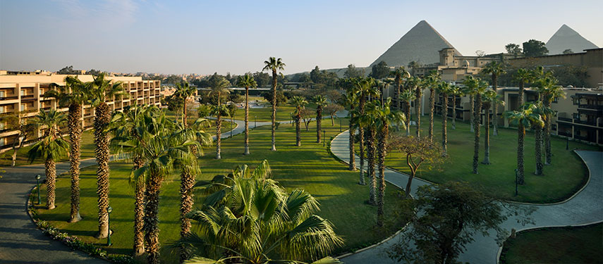 Lavish gardens with palm trees at Marriott Mena House