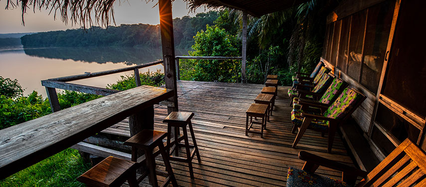 Rustic charm of the observation deck and bar at Sangha Camp, overlooking the Sangha River