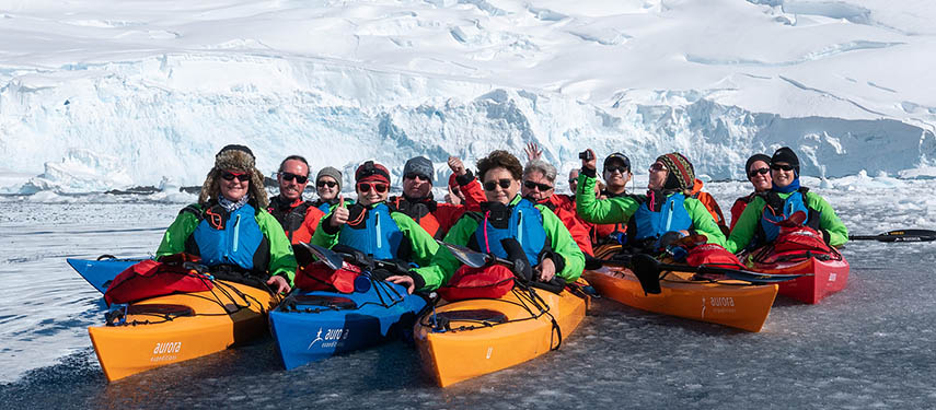 Tourists kayaking between icebergs, Hydrurga Rocks, Antarctica