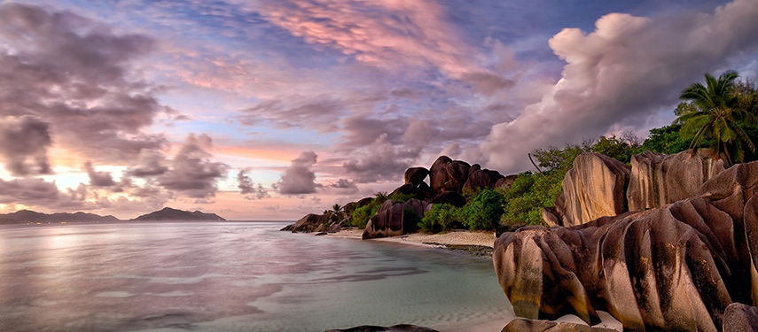Soft evening light over the iconic granite rocks of La Digue Island, Seychelles.