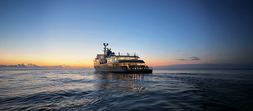 Aqua Lares illuminated at dusk as the sun dips below the horizon.
