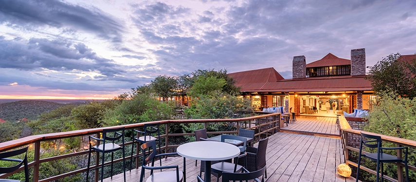 Outdoor deck at Etosha Safari Lodge overlooking the bush at sunset