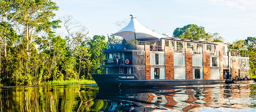 The Aqua Nera luxury boat on a Peruvian Amazon River cruise through the lush Amazon Rainforest