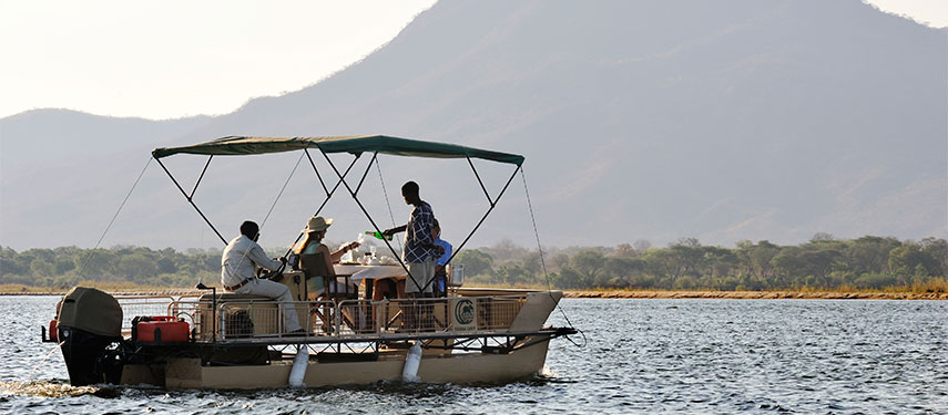 Sundowners on a boat on the Zambezi River, Zambia