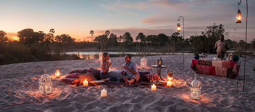Sunset beach picnic on a sandbar in the Zambezi River, Zambia