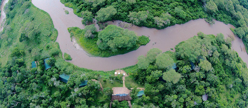 Aerial view of Ishasha Tented Camp situated beside the river