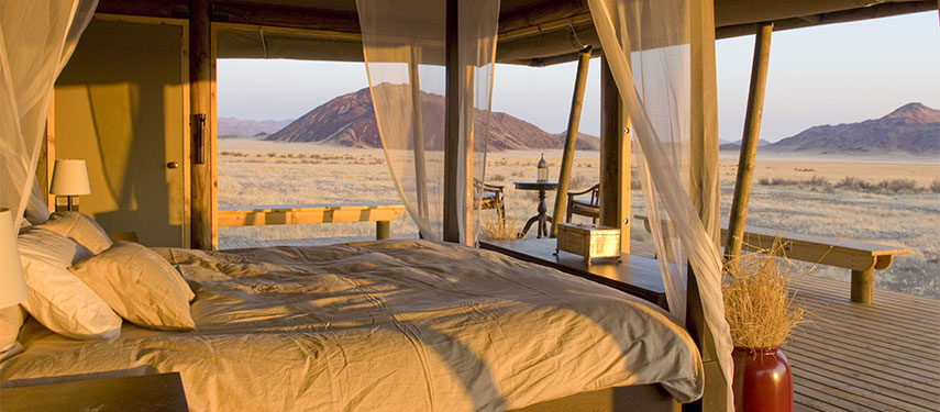From your bed look over the NamibRand Nature Reserve at Wolwedans Boulders